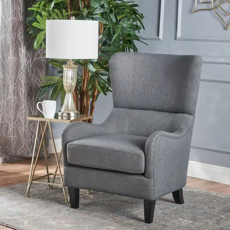 Sillón decorativo de respaldo alto con diseño de orejero y patas de madera de abedul
