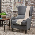 Sillón decorativo de respaldo alto con diseño de orejero y patas de madera de abedul