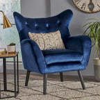 Sillón auxiliar tapizado en terciopelo azul marino con orejeras