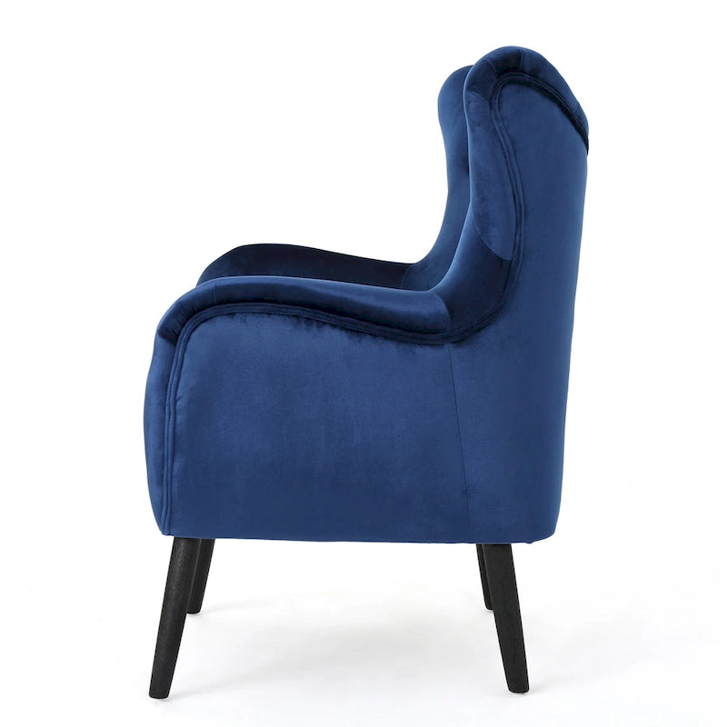 Sillón auxiliar tapizado en terciopelo azul marino con orejeras