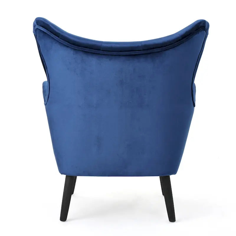 Sillón auxiliar tapizado en terciopelo azul marino con orejeras