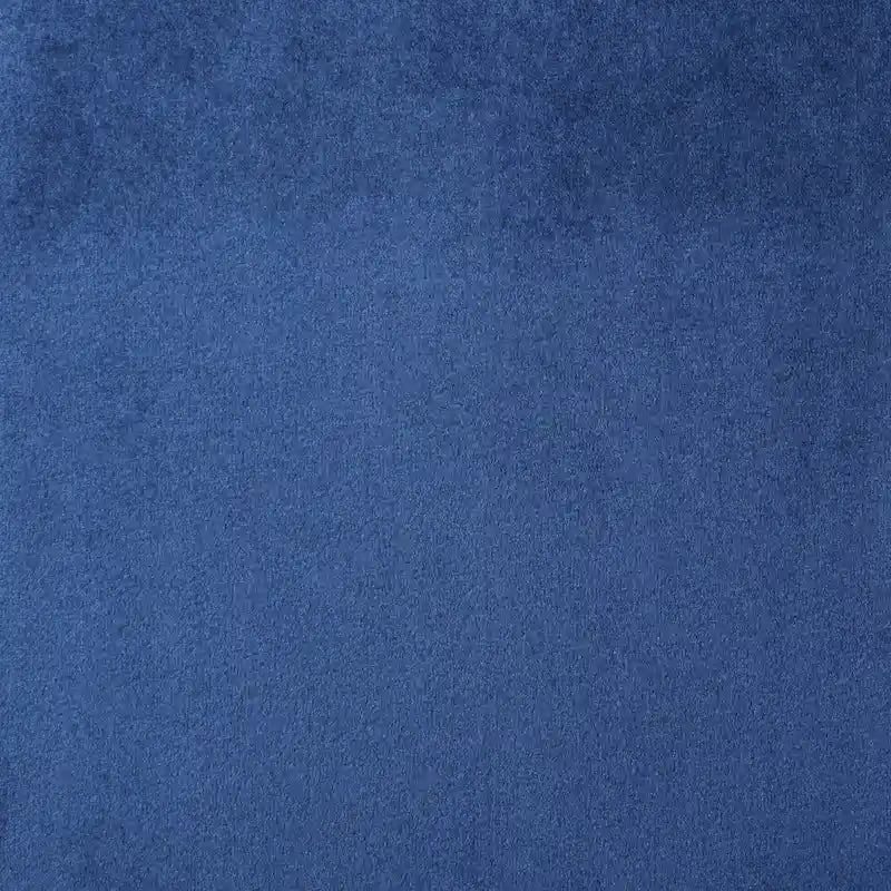 Sillón auxiliar tapizado en terciopelo azul marino con orejeras
