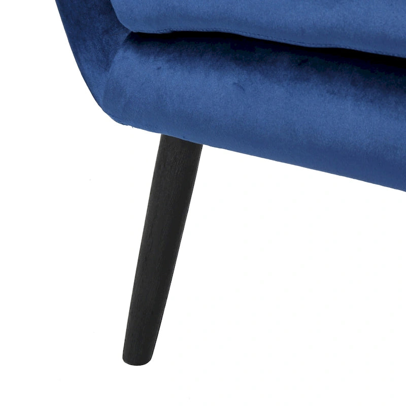 Sillón auxiliar tapizado en terciopelo azul marino con orejeras