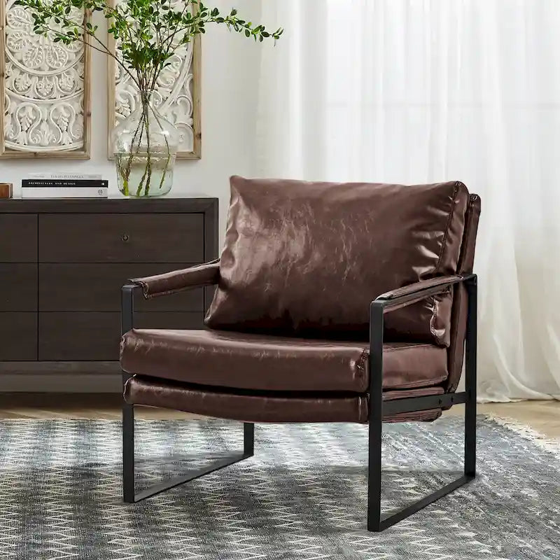 Sillón tapizado en piel sintética moderna con estructura de acero