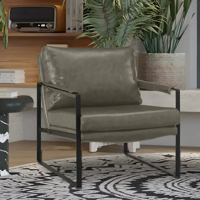 Sillón tapizado en piel sintética moderna con estructura de acero