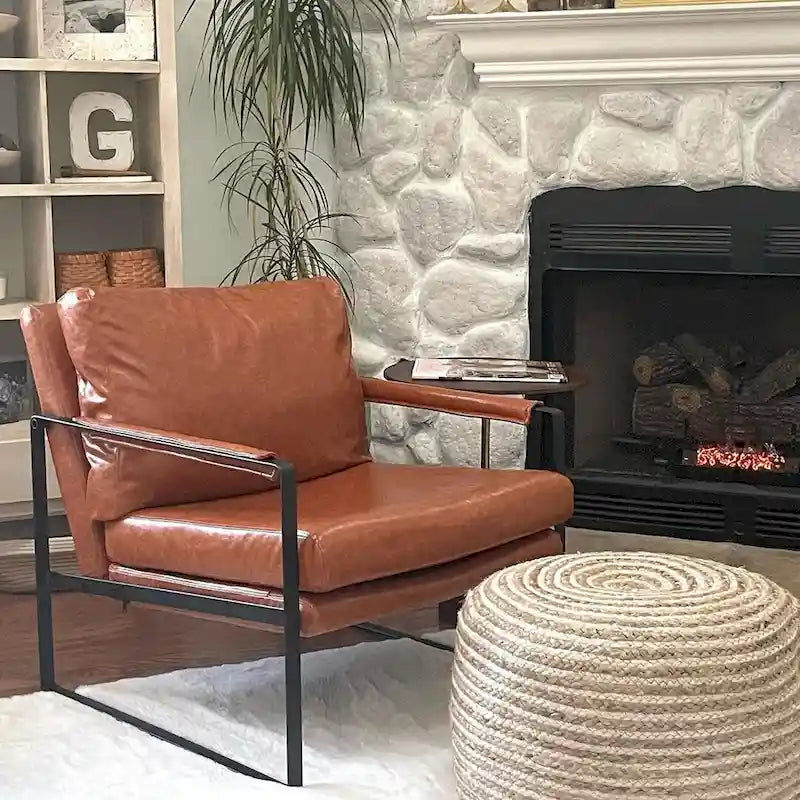 Sillón tapizado en piel sintética moderna con estructura de acero
