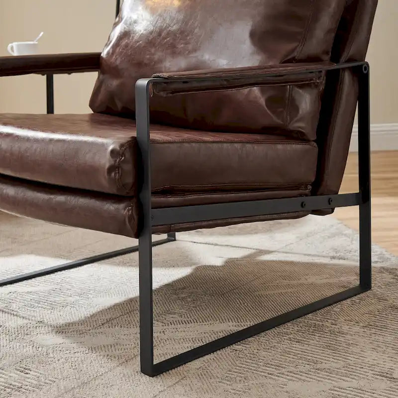 Sillón tapizado en piel sintética moderna con estructura de acero