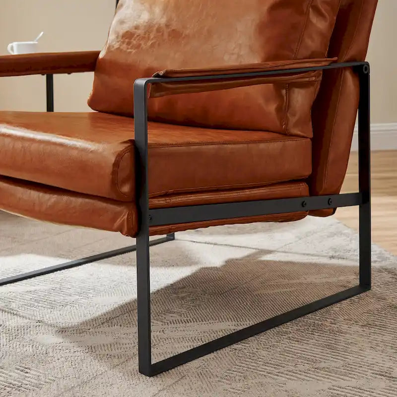 Sillón tapizado en piel sintética moderna con estructura de acero