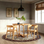 Mesa de comedor redonda de madera maciza con patas geométricas