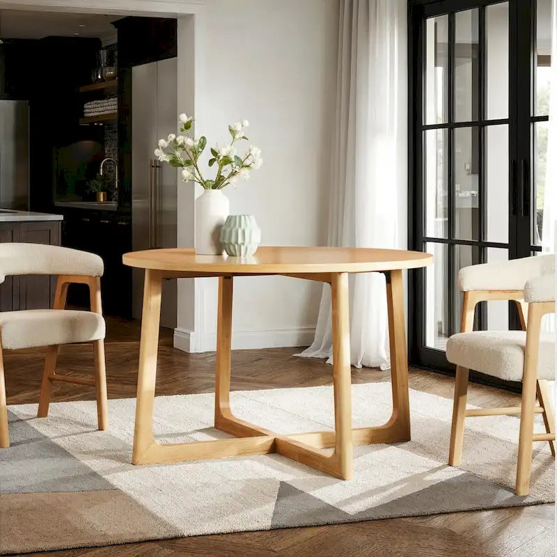 Mesa de comedor redonda de madera maciza con patas geométricas