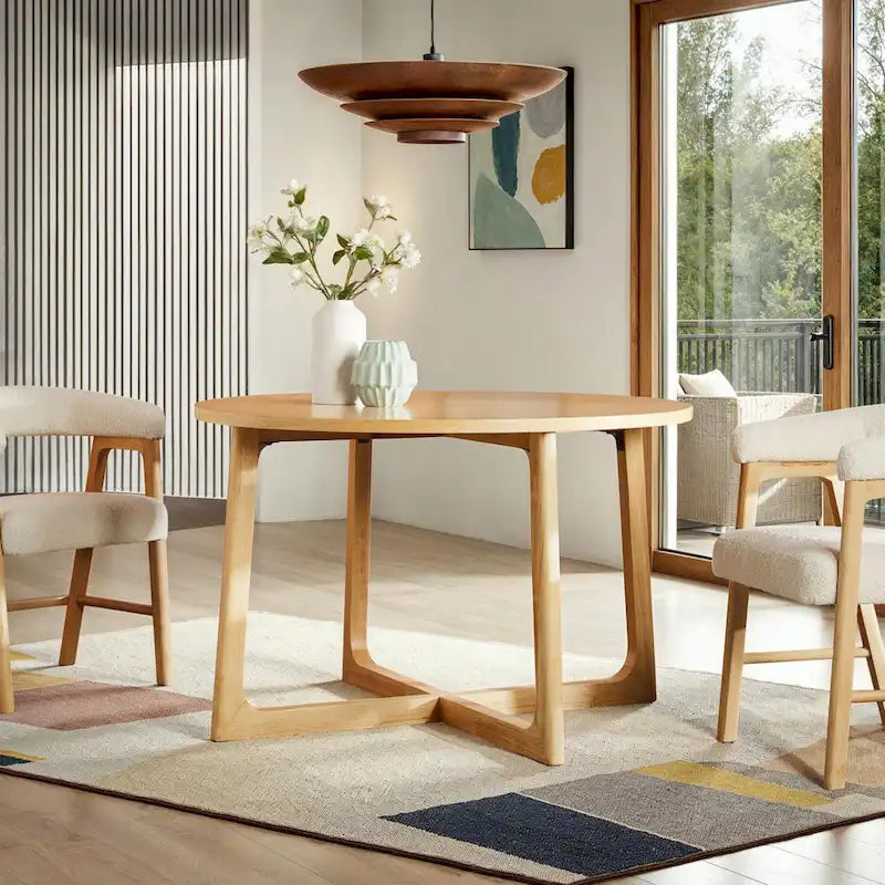 Mesa de comedor redonda de madera maciza con patas geométricas