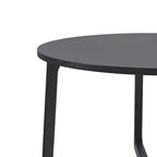 Mesa de comedor redonda de madera maciza con patas geométricas